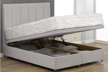 Ottoman storage bed with floor standing headboard
